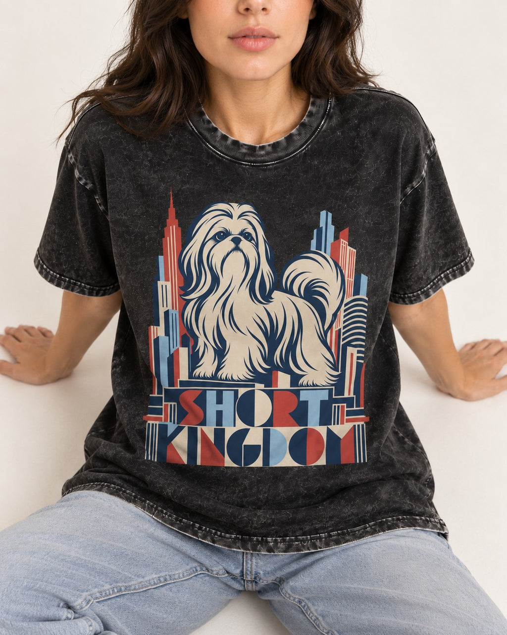 Shih Tzu Short Kingdom Art Deco Skyline Graphic Washed Tee in Black, worn by a seated model