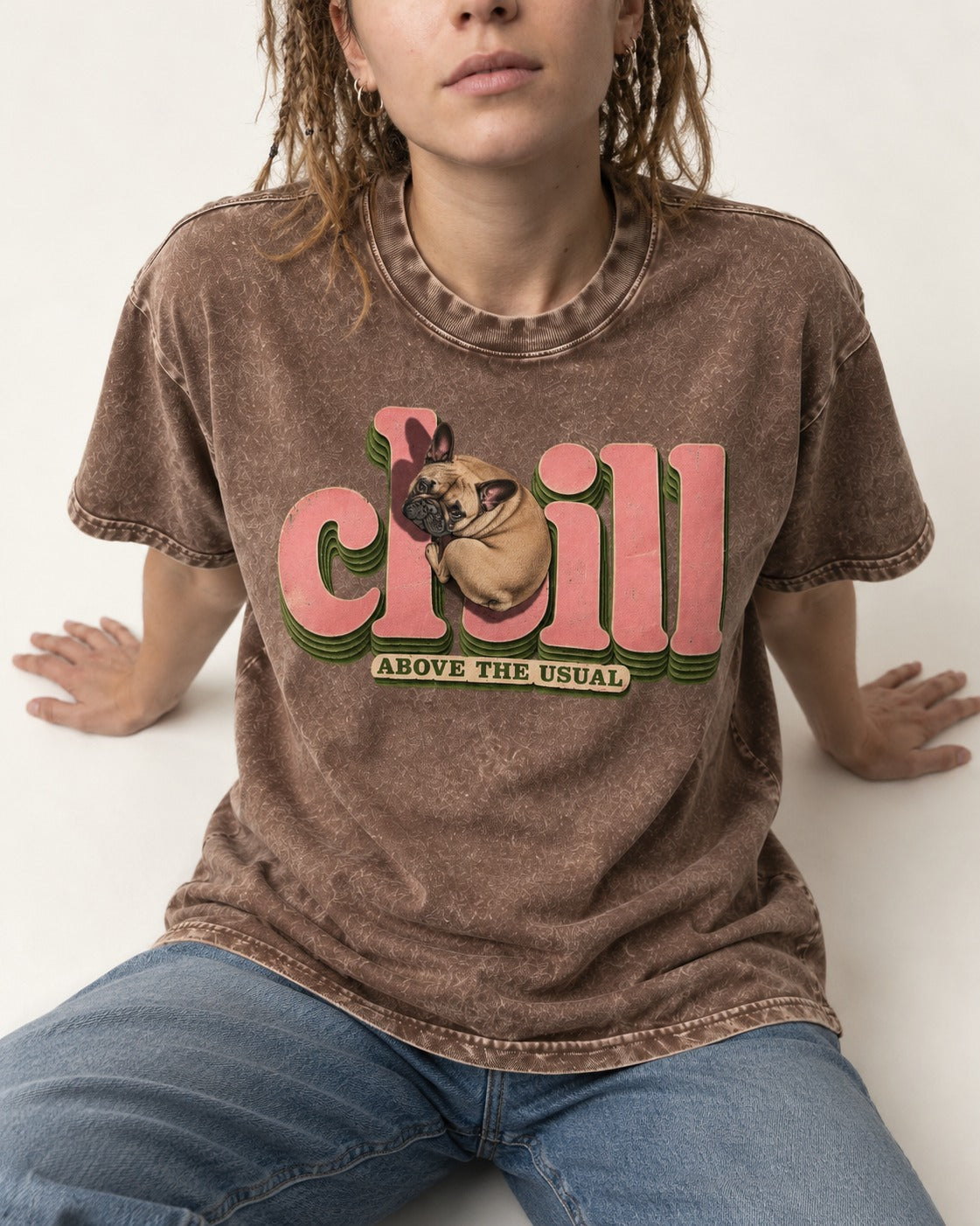 Frenchie Chill Washed Tee in Coffee, worn by a seated model