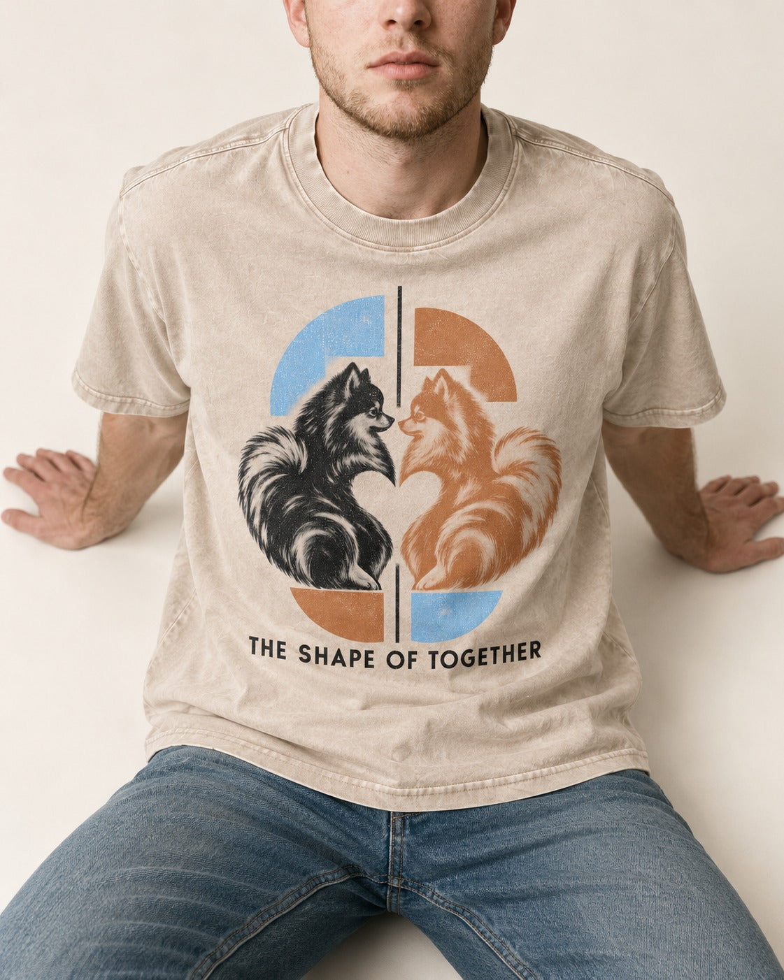 Pomeranian The Shape of Together Washed Tee in Apricot, worn by a seated model