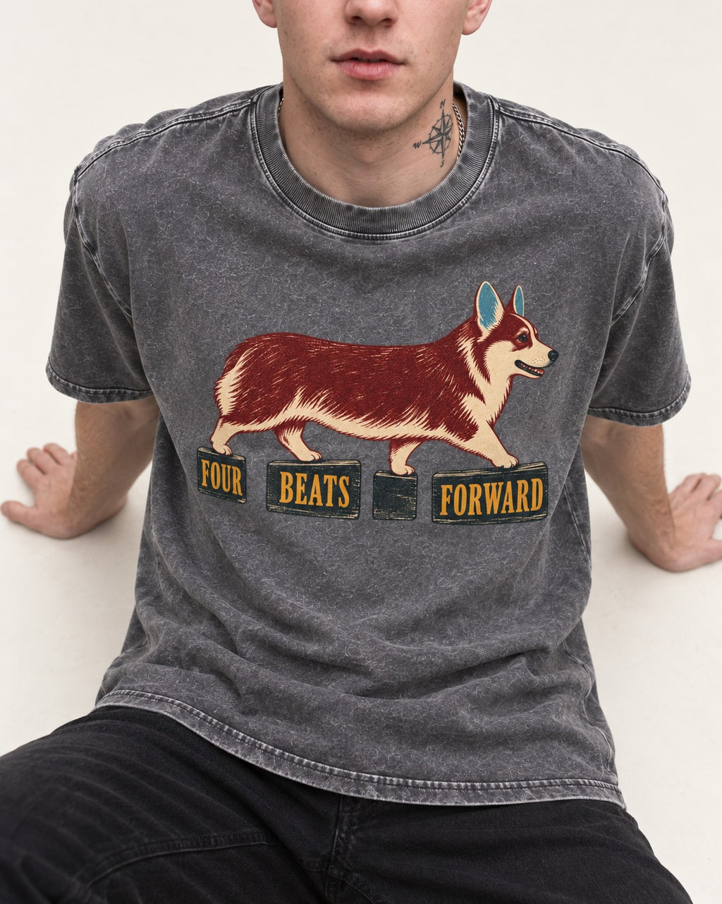 Corgi Four Beats Forward Washed Tee in Gray, worn by a seated model