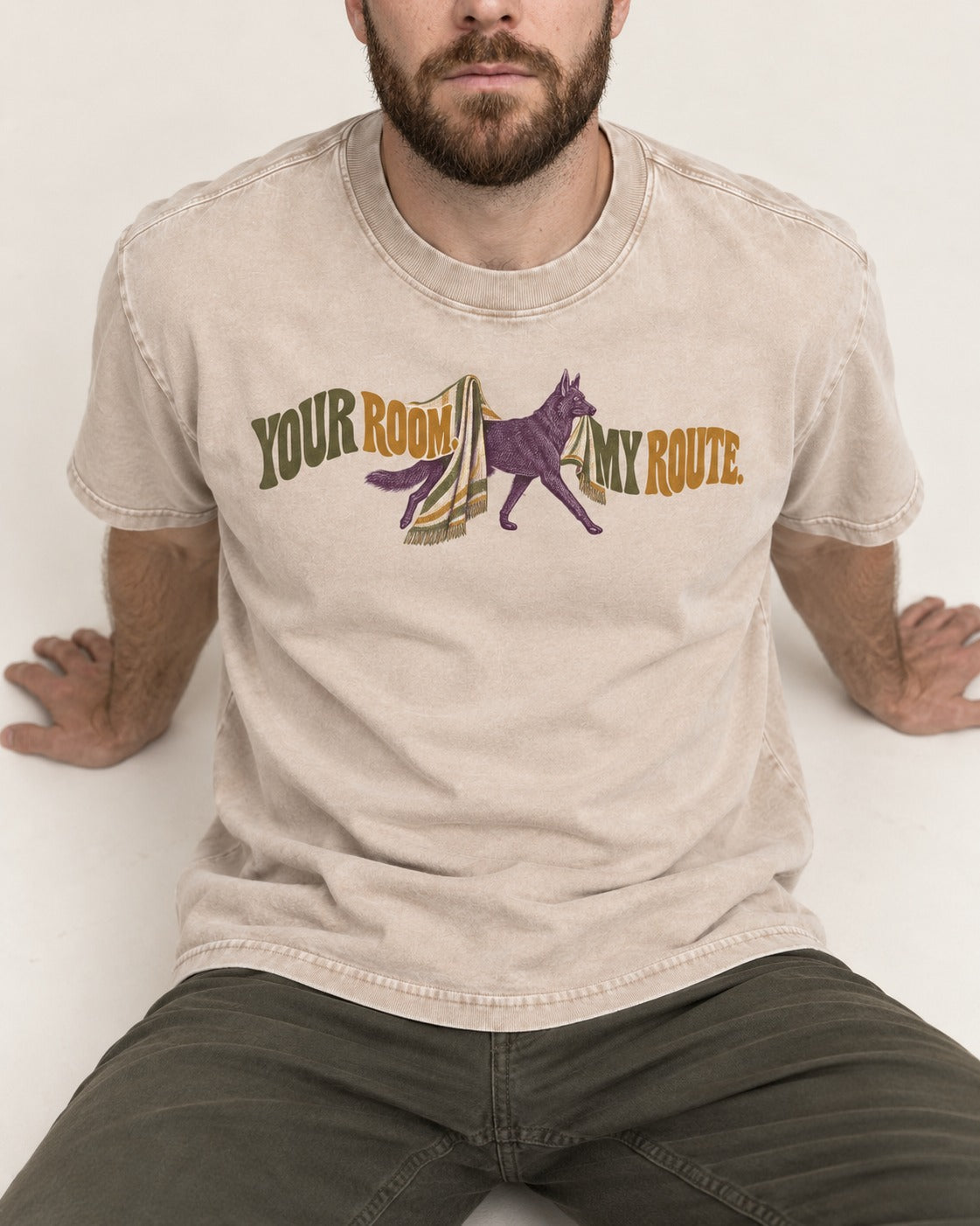 Your Room My Route German Shepherd Dog Washed Tee in Apricot, worn by a seated model