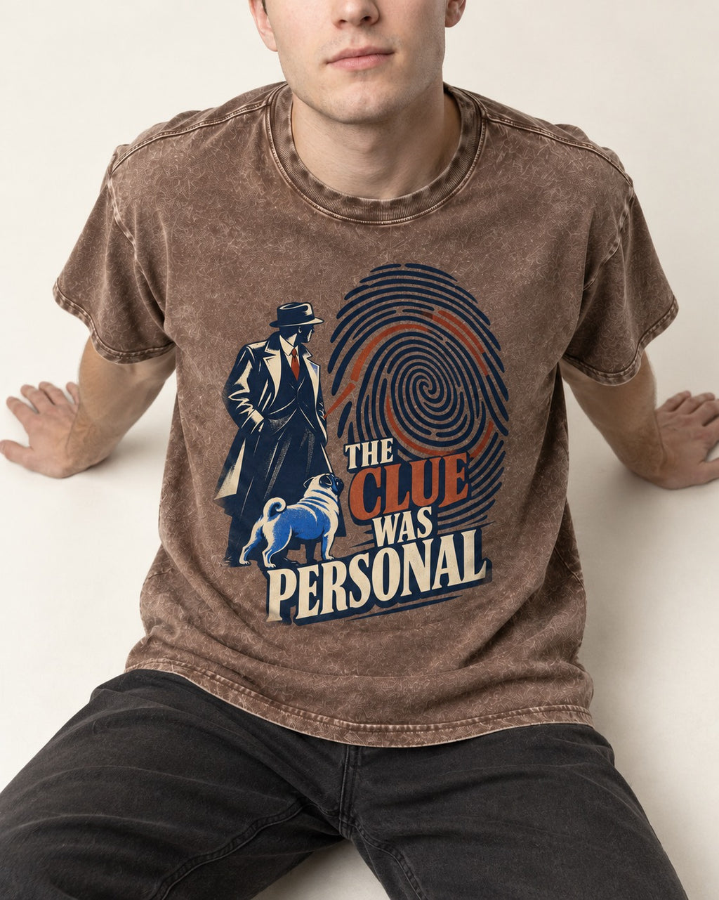 The Pug Clue Was Personal Washed Tee in Coffee, worn by a seated model