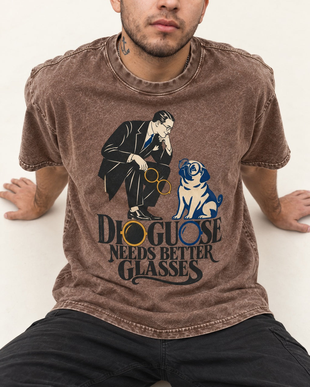 Pug Needs Better Glasses Washed Tee in Coffee, worn by a seated model