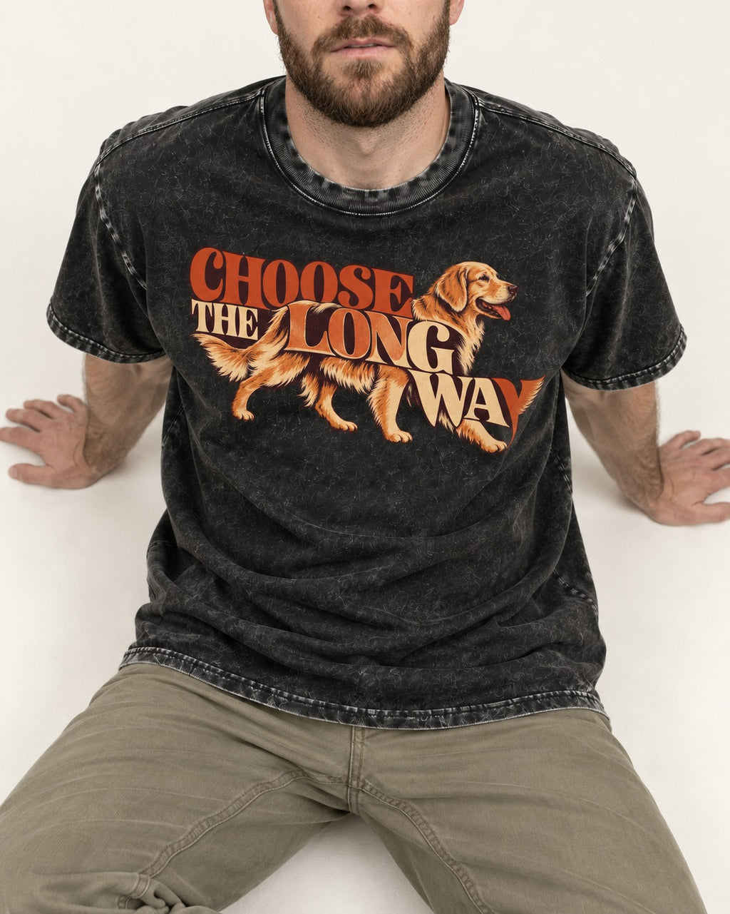 Golden Retriever Choose The Long Way Retro Graphic Washed Tee in Black, worn by a seated model