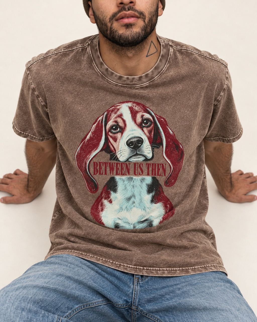 Beagle Between Us Then Washed Tee in Coffee, worn by a seated model