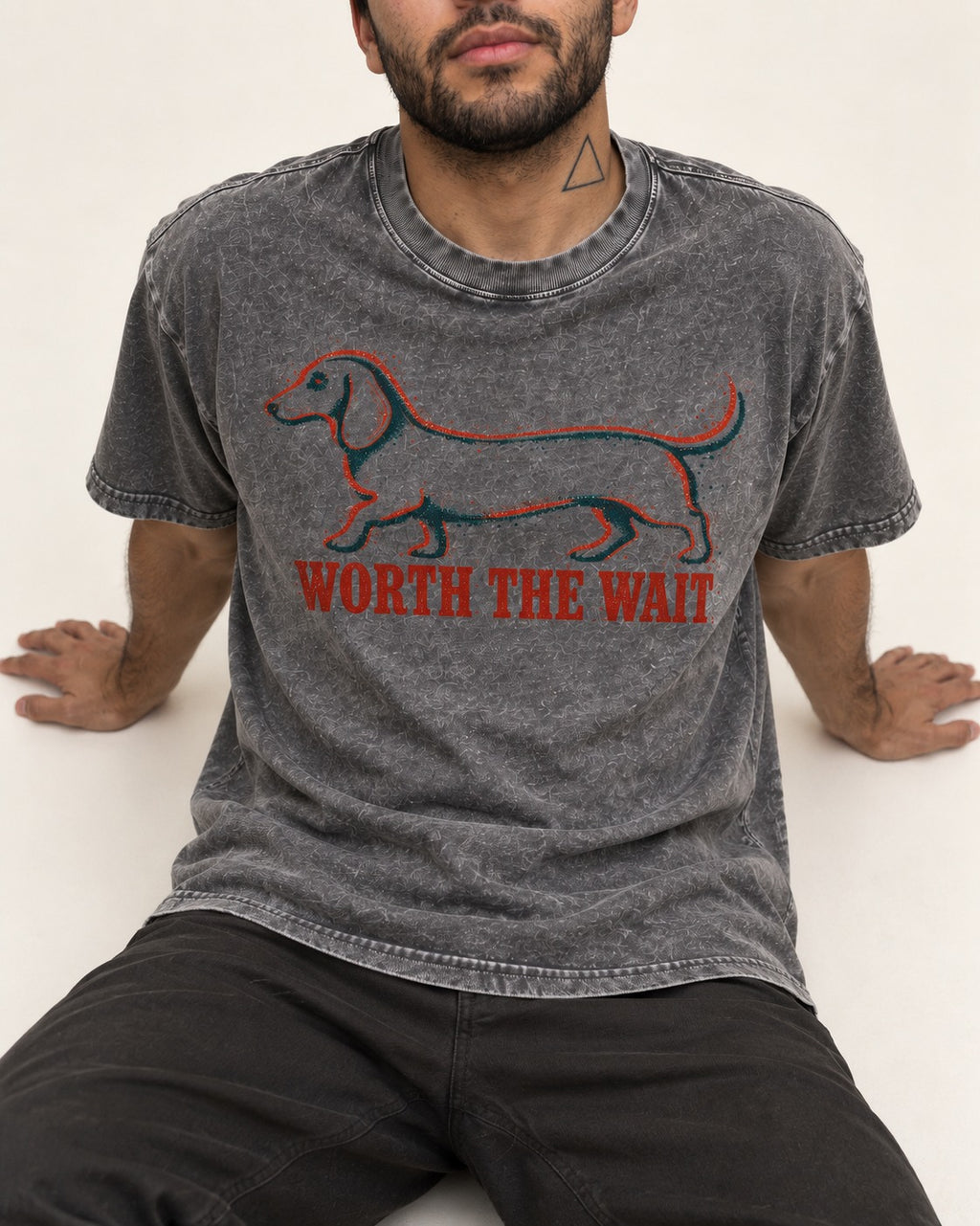 Dachshund Worth The Wait Distressed Outline Graphic Washed Tee in Gray, worn by a seated model
