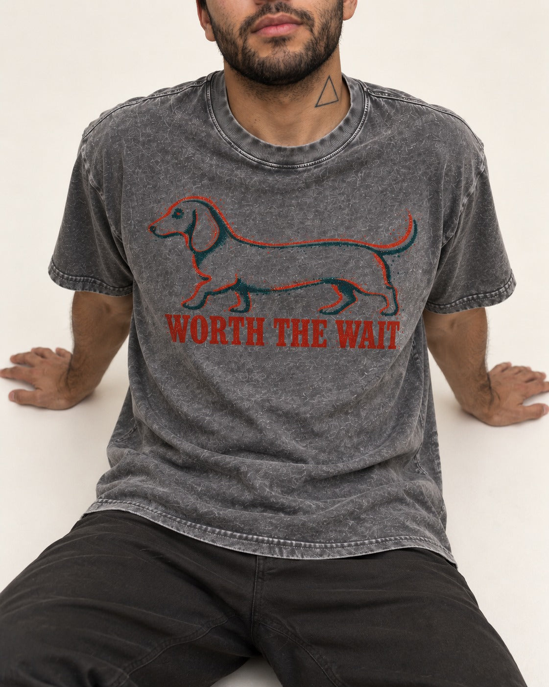 Dachshund Worth The Wait Distressed Outline Graphic Washed Tee in Gray, worn by a seated model
