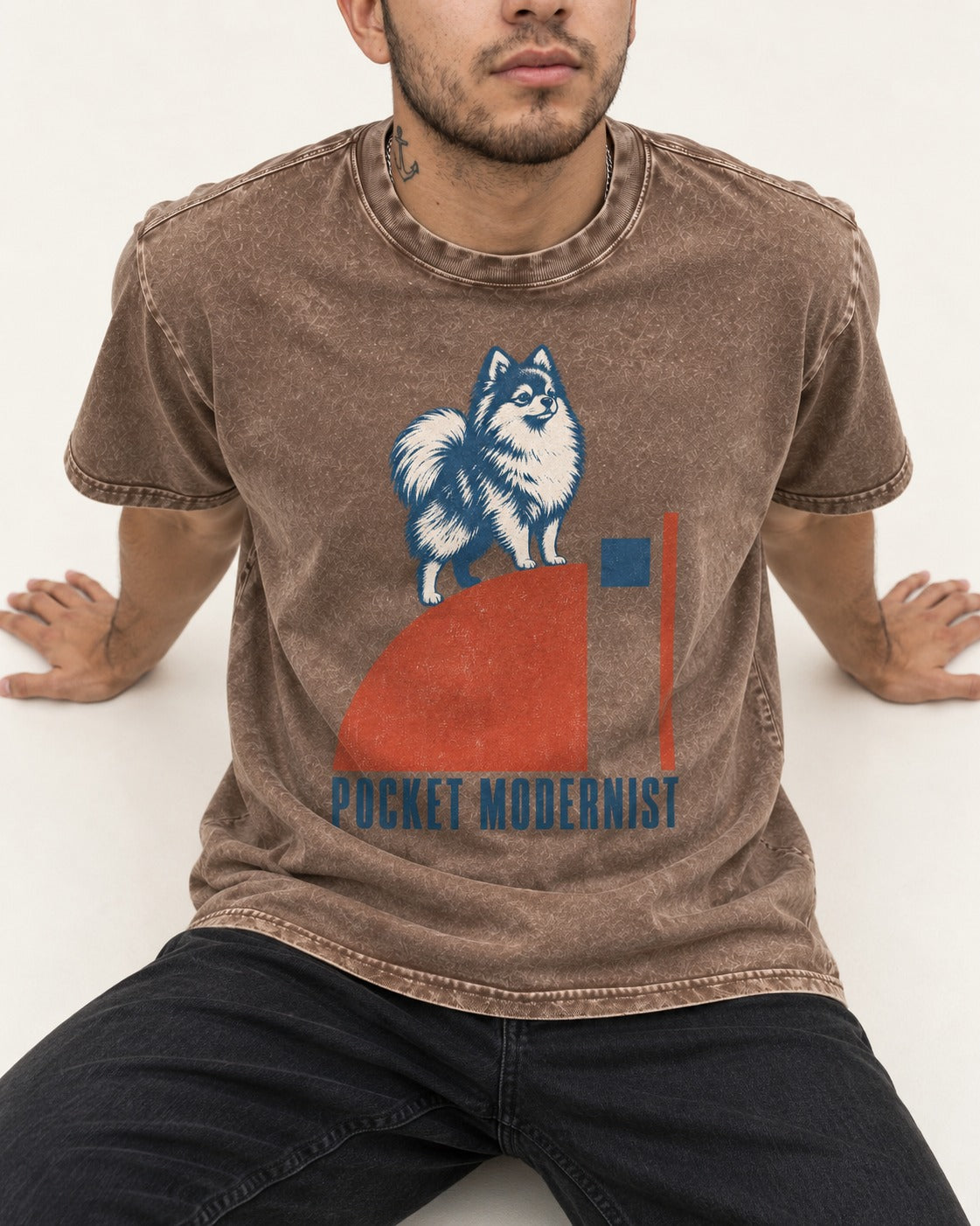 Pocket Modernist Pomeranian Washed Tee in Coffee, worn by a seated model