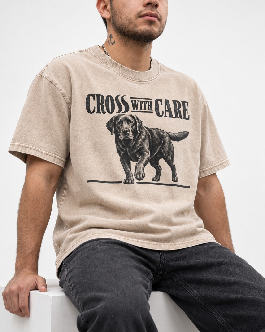 Labrador Retriever Cross with Care Washed Tee in Apricot, worn by a seated model