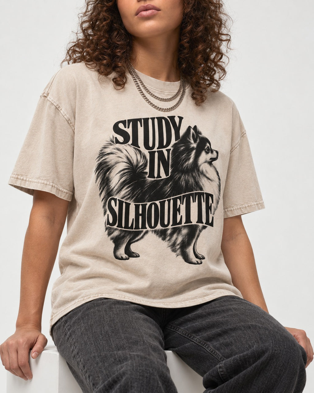 Pomeranian Study in Silhouette Washed Tee in Apricot, worn by a seated model