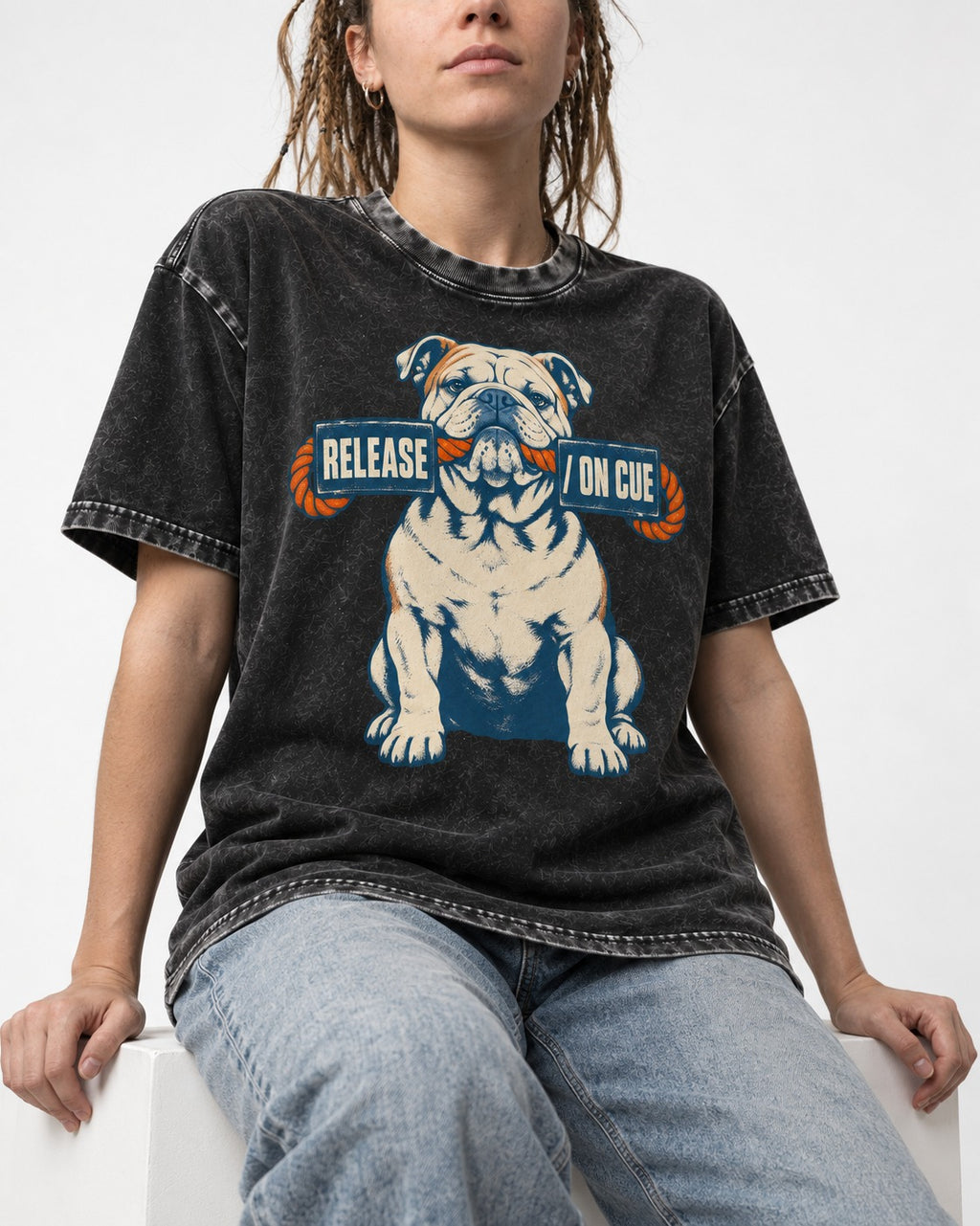 English Bulldog Release on Cue Rope Sign Graphic Washed Tee in Black, worn by a seated model