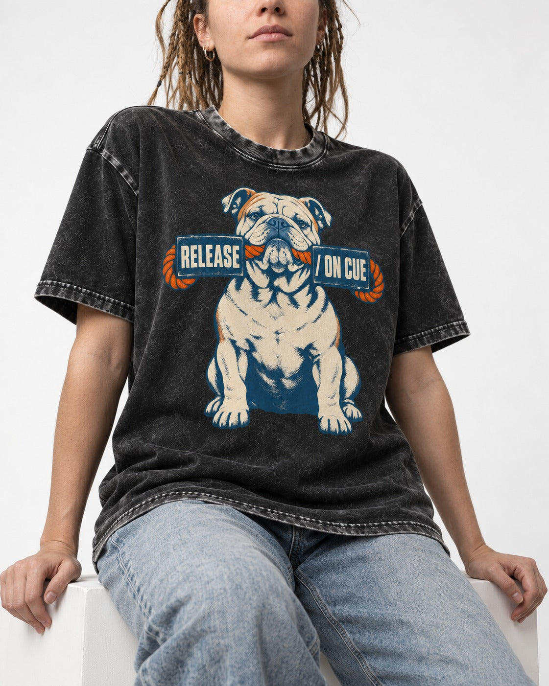 English Bulldog Release on Cue Rope Sign Graphic Washed Tee in Black, worn by a seated model