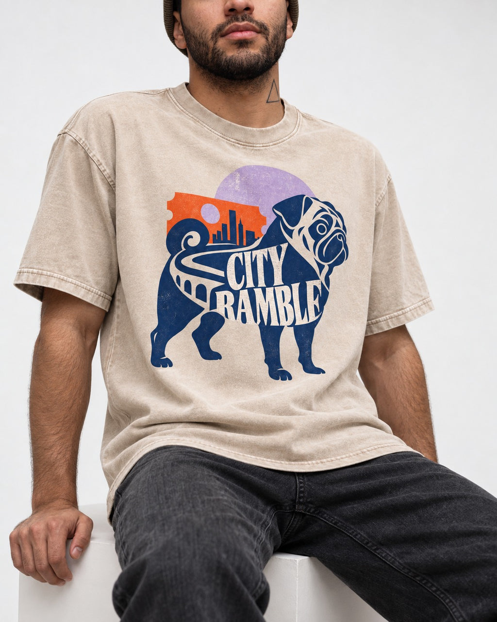 Pug's Big City Ramble Washed Tee in Apricot, worn by a seated model