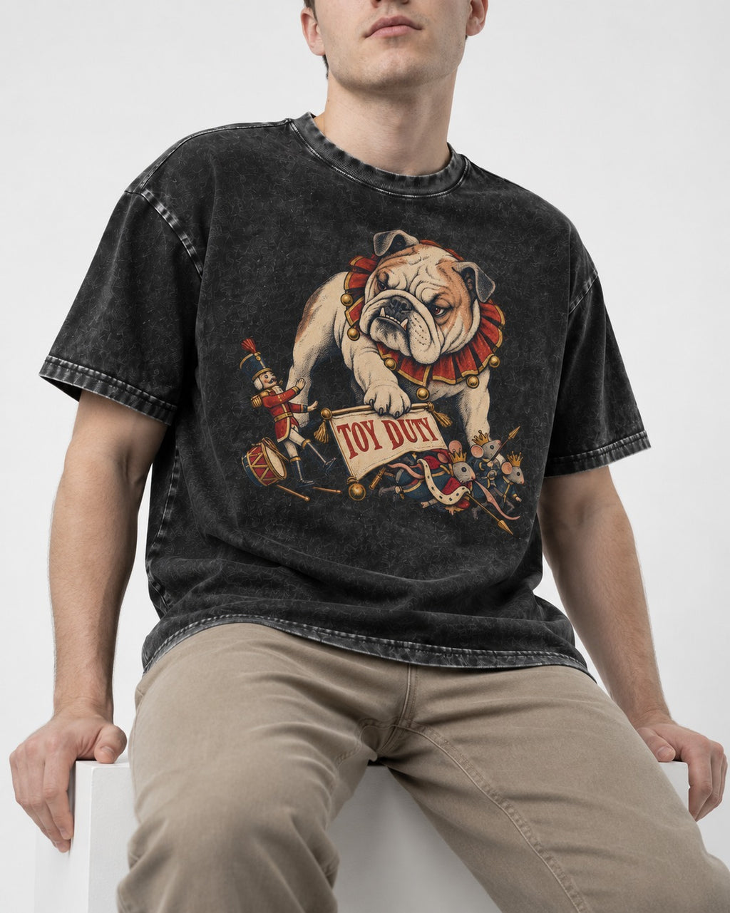 English Bulldog Toy Duty Nutcracker Mice Washed Tee in Black, worn by a seated model