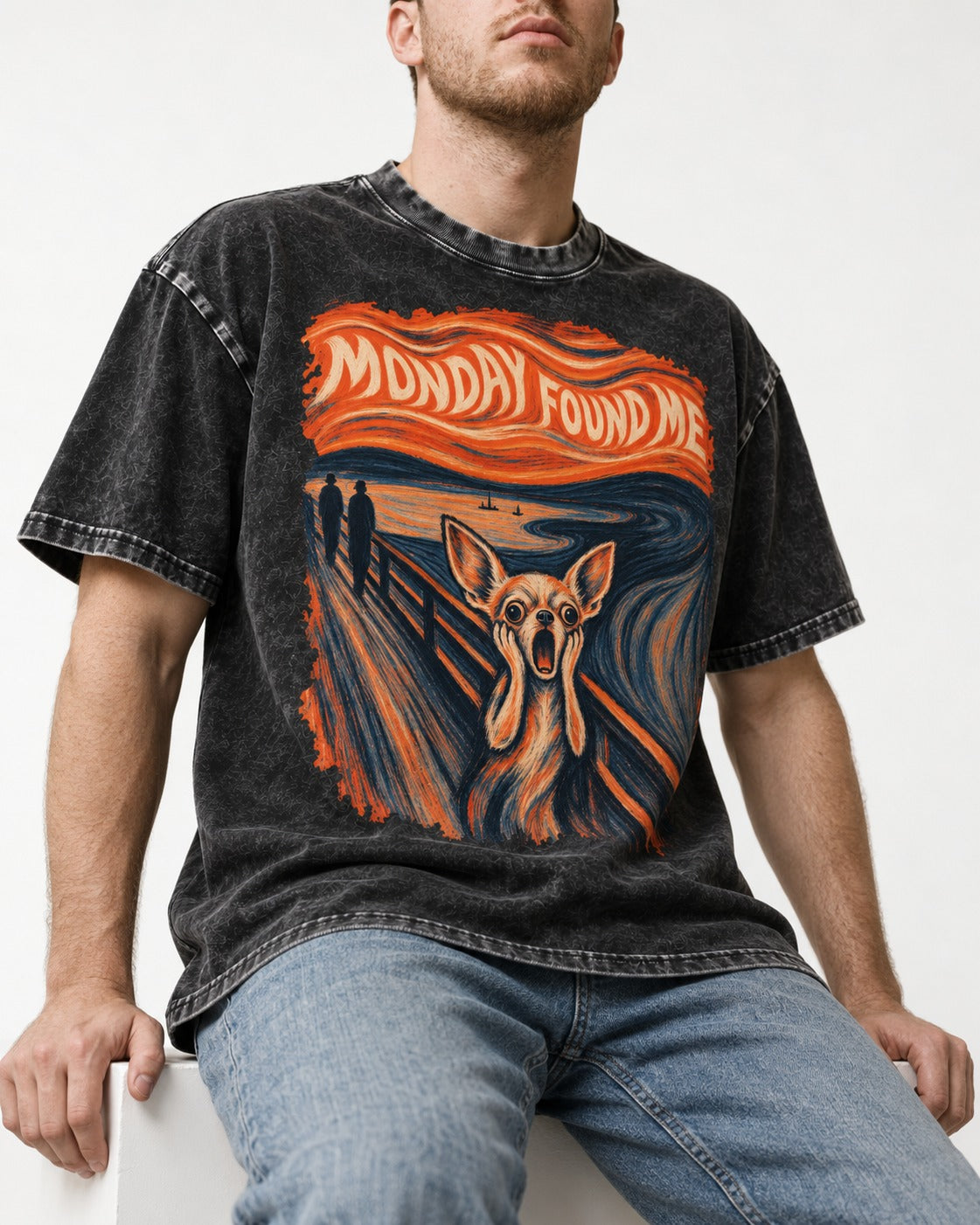 Monday Found Me Chihuahua Scream Banner Washed Tee in Black, worn by a seated model