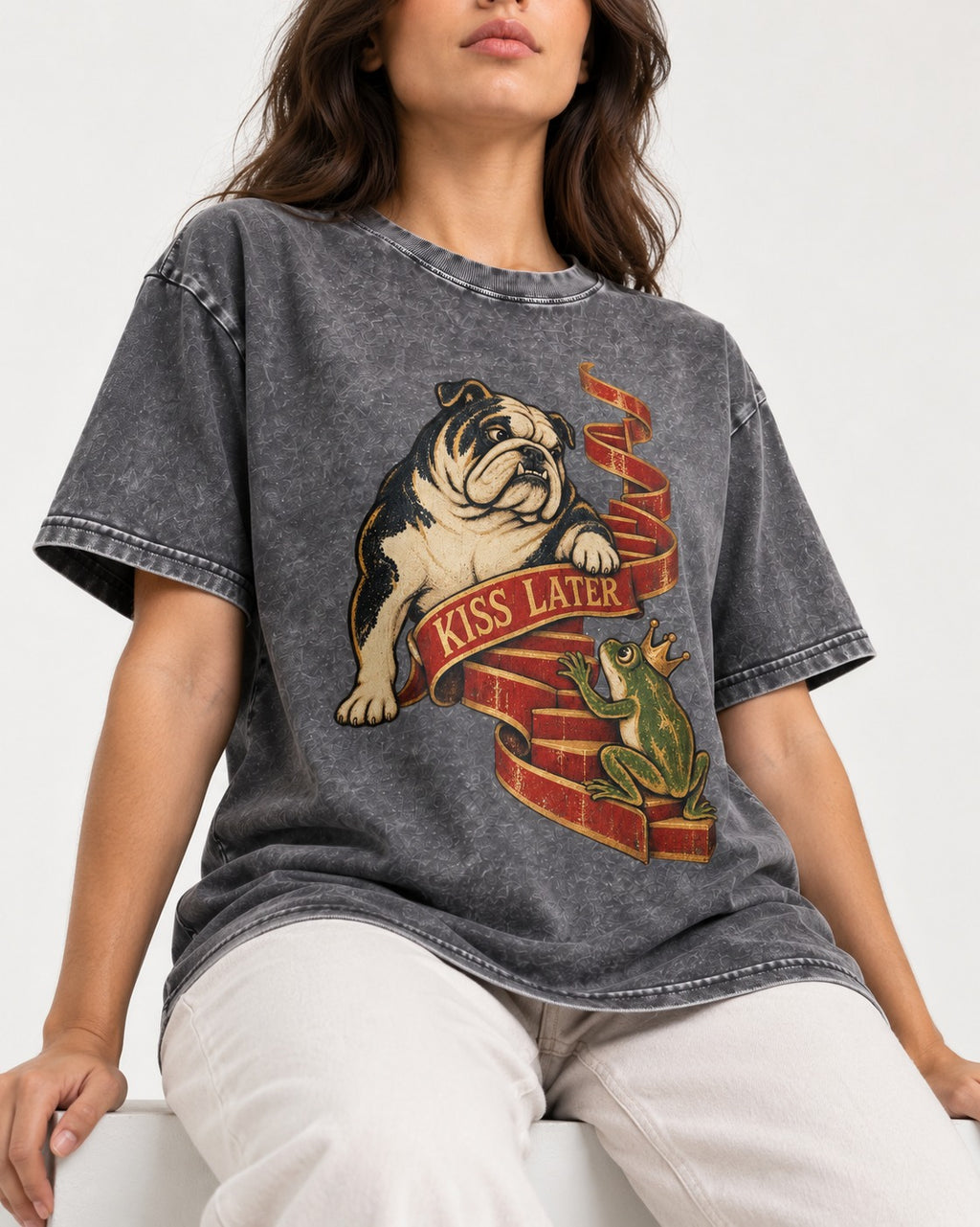 English Bulldog Kiss Later Frog Prince Graphic Washed Tee in Gray, worn by a seated model