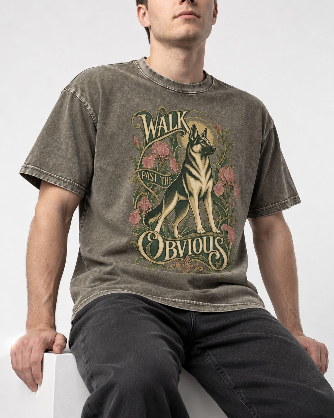 Walk Past The Obvious Art Nouveau German Shepherd Dog Graphic Washed Tee in Army Green, worn by a seated model