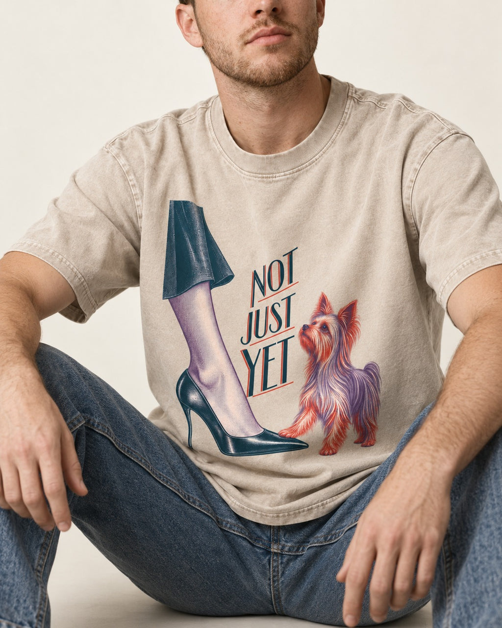Not Just Yet Yorkshire Terrier Washed Tee in Apricot, worn by a seated model