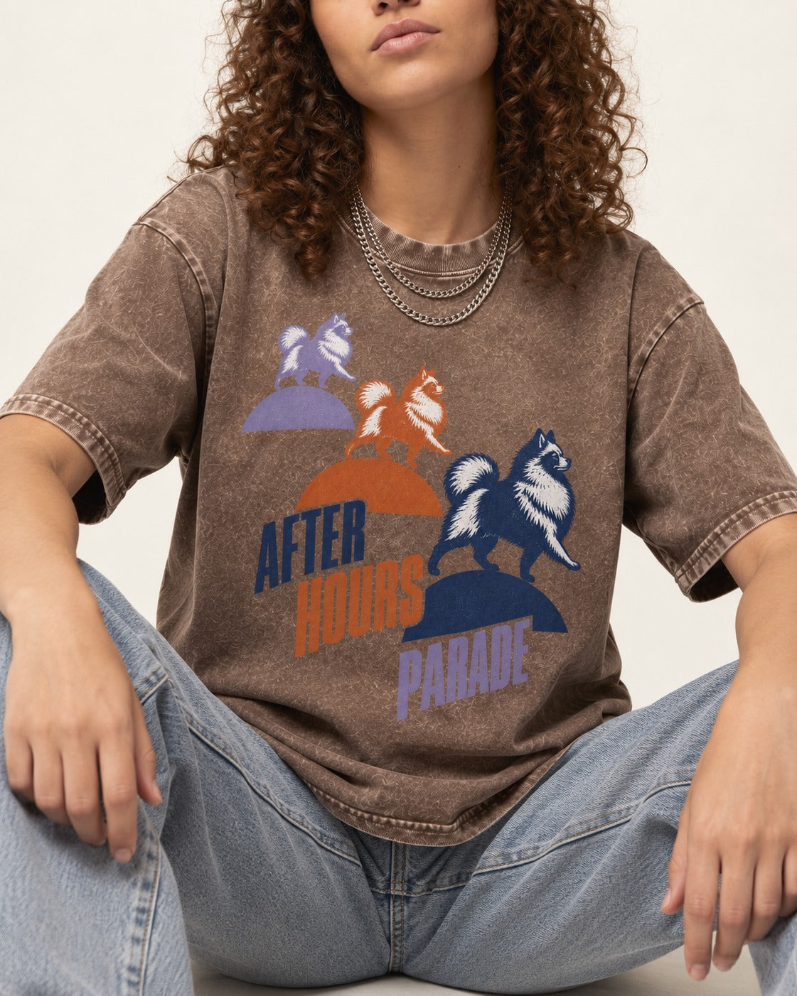 Pomeranian After Hours Parade Washed Tee in Coffee, worn by a seated model