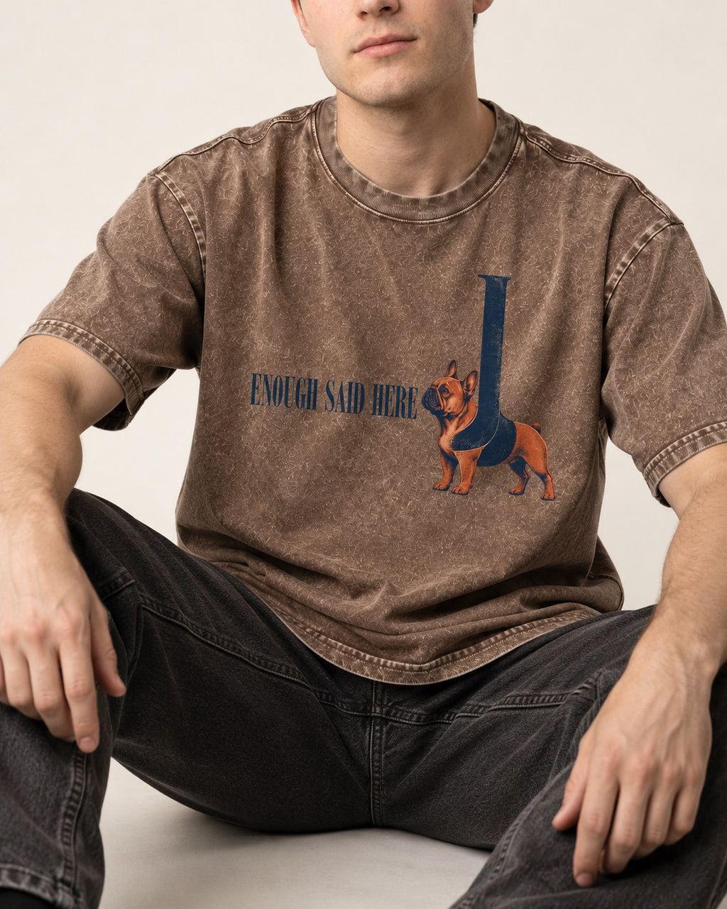 Frenchie Enough Said Washed Tee in Coffee, worn by a seated model