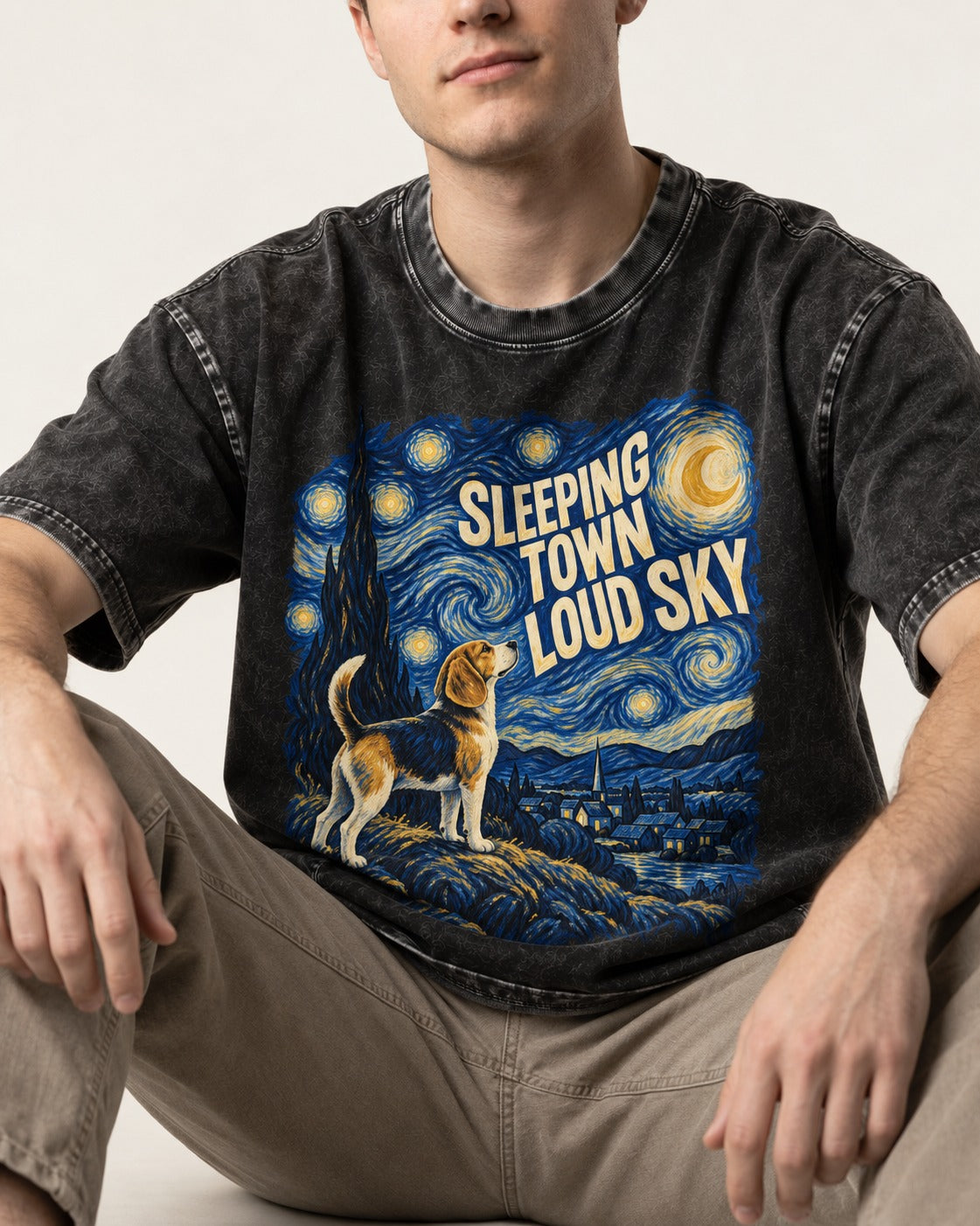Sleeping Town Loud Sky Beagle Nightscape Washed Tee in Black, worn by a seated model
