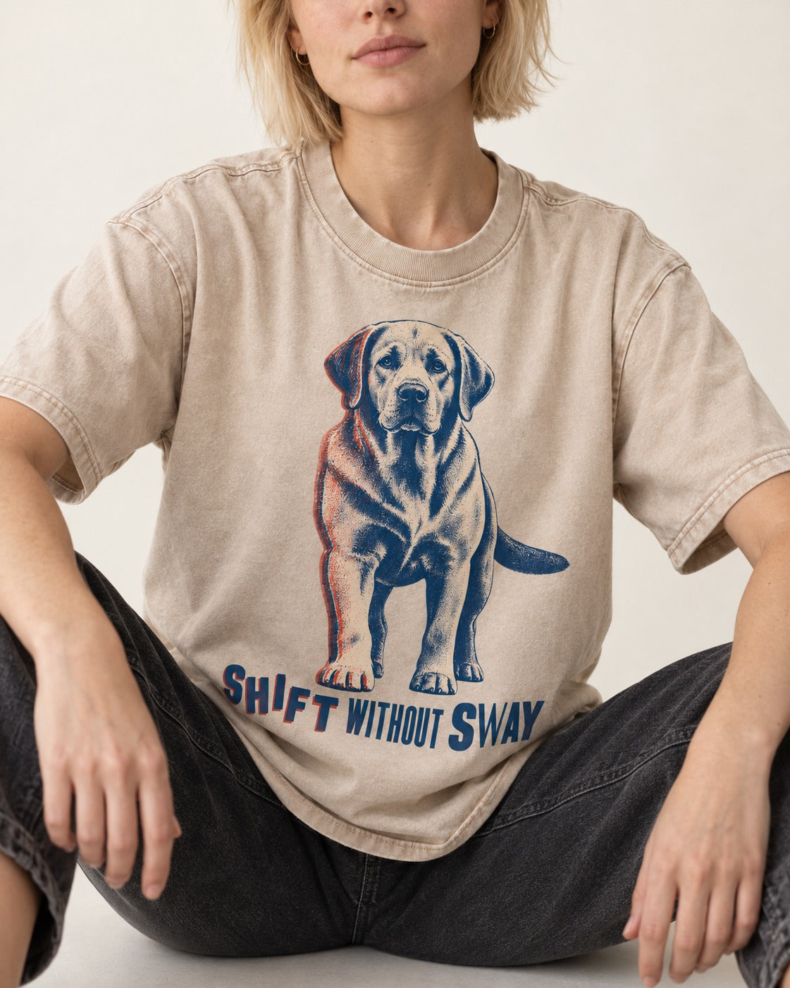Shift Without Sway Labrador Retriever Washed Tee in Apricot, worn by a seated model