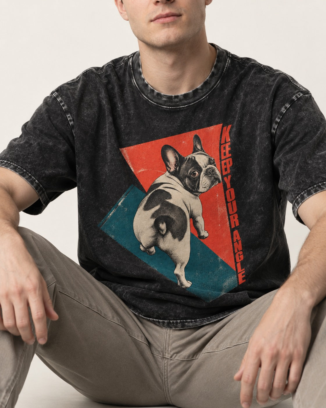 Frenchie Keep Your Angle Geometric Graphic Washed Tee in Black, worn by a seated model