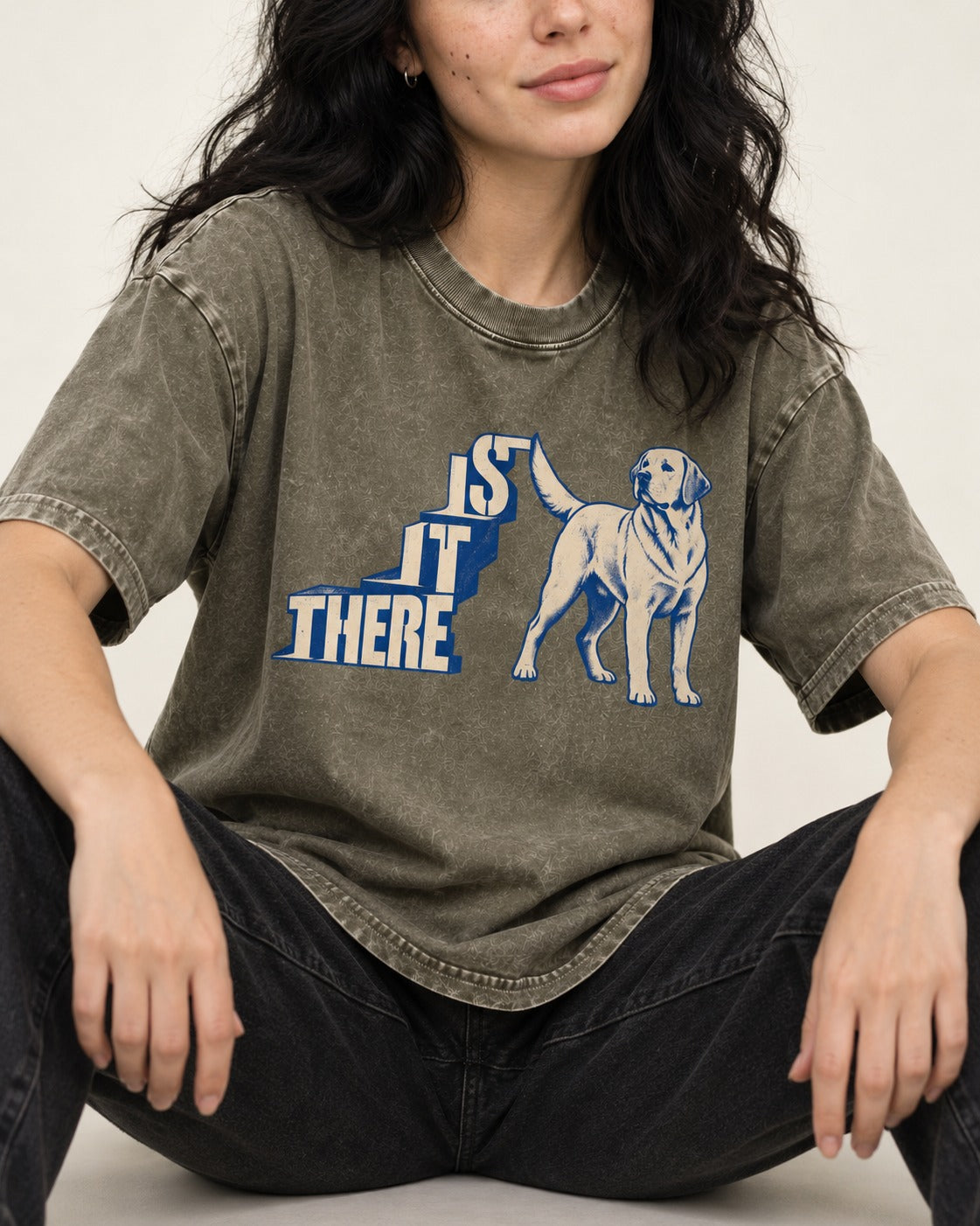 Labrador Retriever Is It There Stair-Step Graphic Washed Tee in Army Green, worn by a seated model