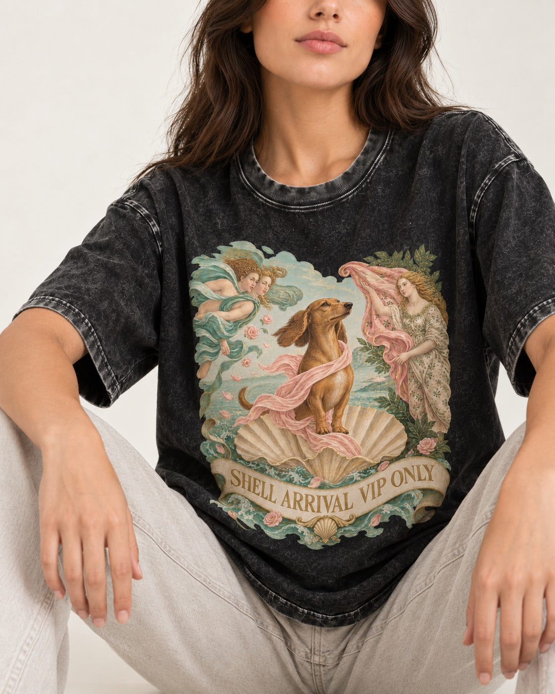 Dachshund Shell Arrival VIP Only Venus Parody Graphic Washed Tee in Black, worn by a seated model