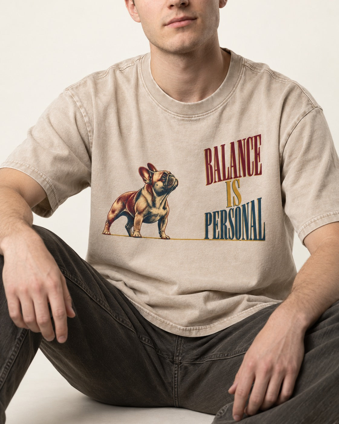 Frenchie Balance Is Personal Washed Tee in Apricot, worn by a seated model