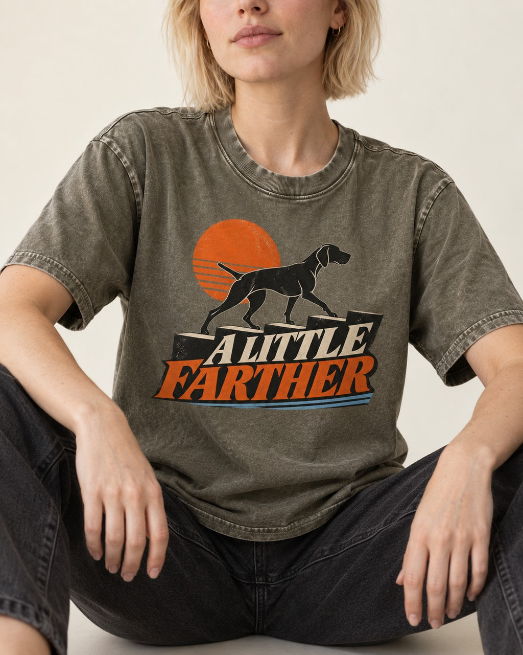 German Shorthaired Pointer A Little Farther Sunset Steps Graphic Washed Tee in Army Green, worn by a seated model