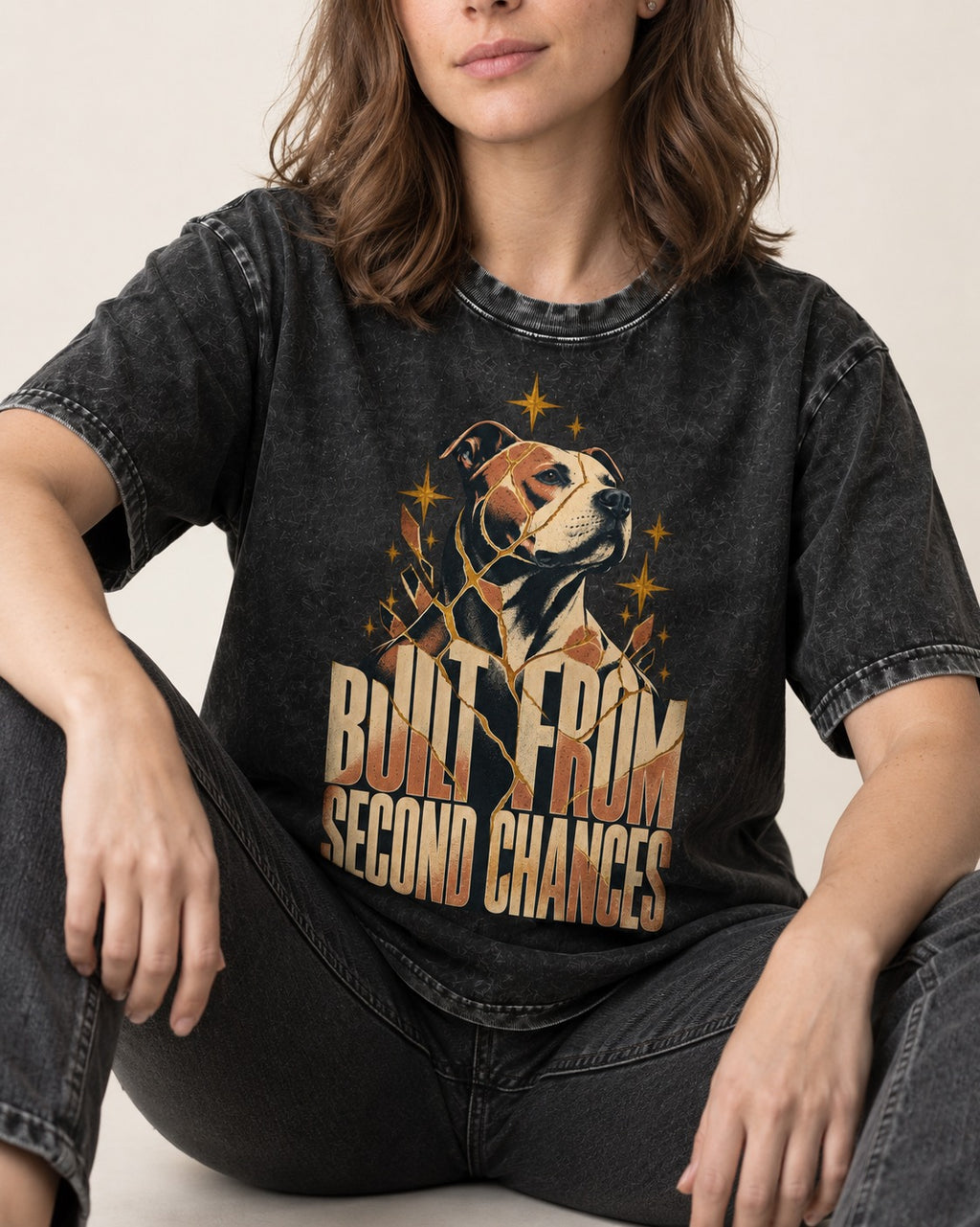 Pitbull Built from Second Chances Kintsugi Graphic Washed Tee in Black, worn by a seated model