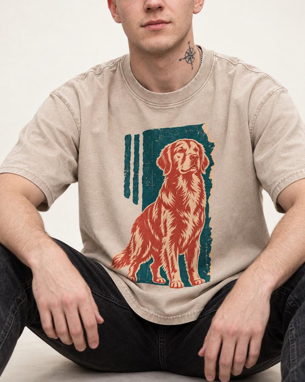 Golden Retriever Steadfast Heart Washed Tee in Apricot, worn by a seated model