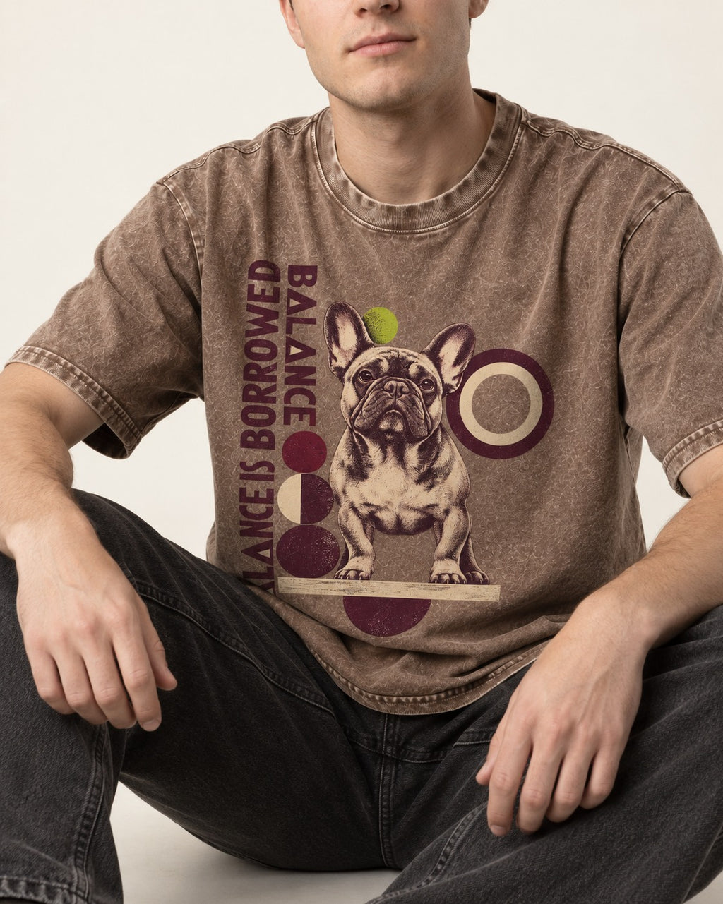 Frenchie's Balance Is Borrowed Washed Tee in Coffee, worn by a seated model