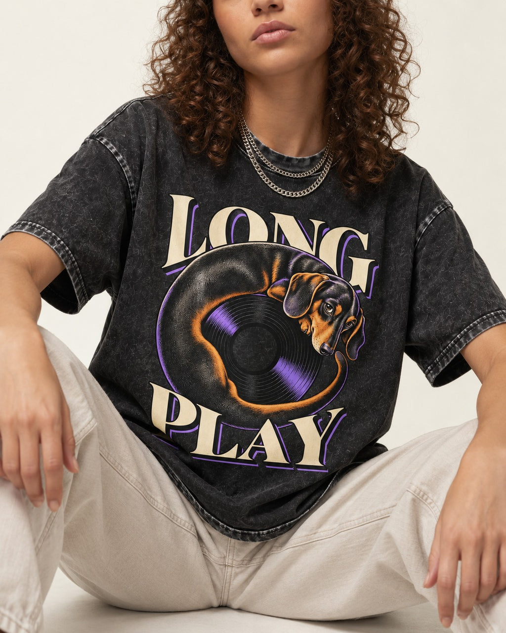 Dachshund Long Play Vinyl Record Graphic Washed Tee in Black, worn by a seated model