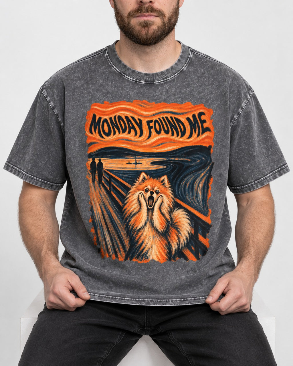 Pomeranian Monday Found Me Scream Parody Graphic Washed Tee in Gray, worn by a seated model