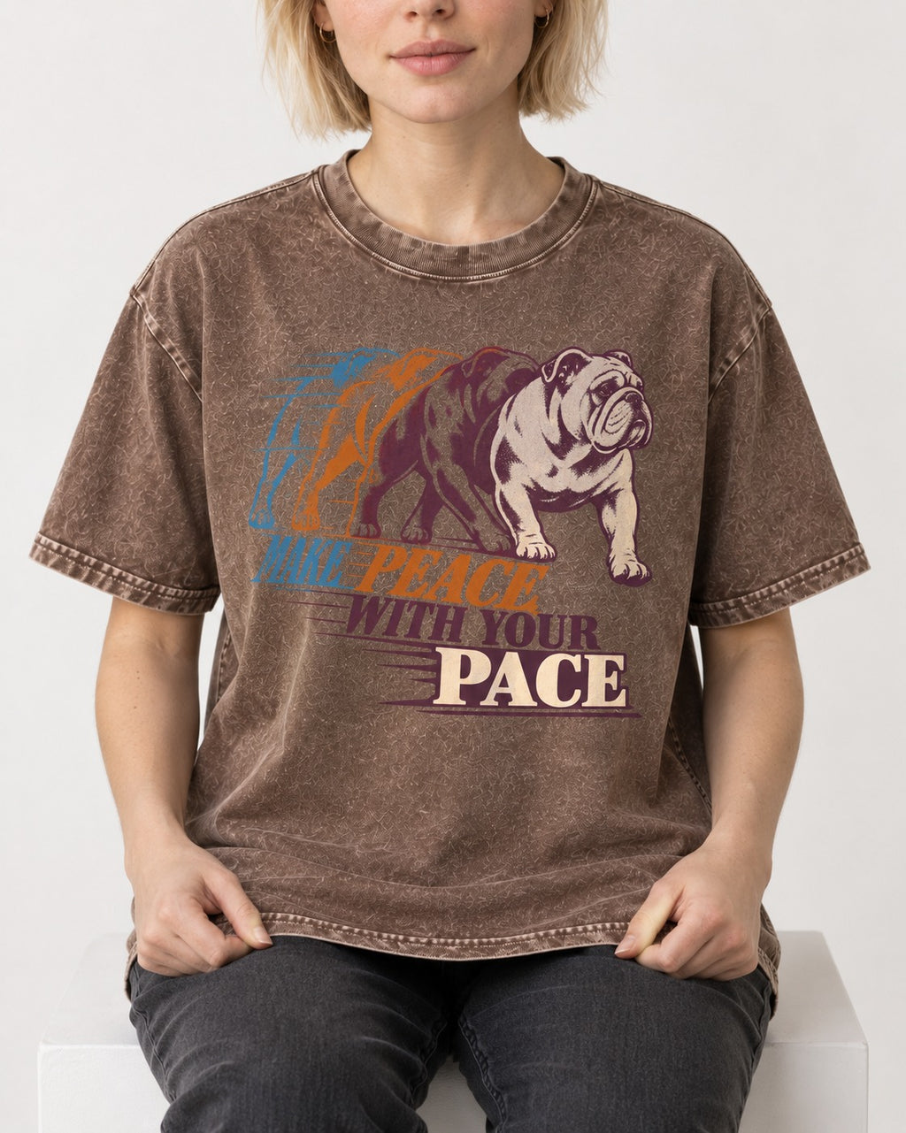 English Bulldog Peace with Your Pace Washed Tee in Coffee, worn by a seated model