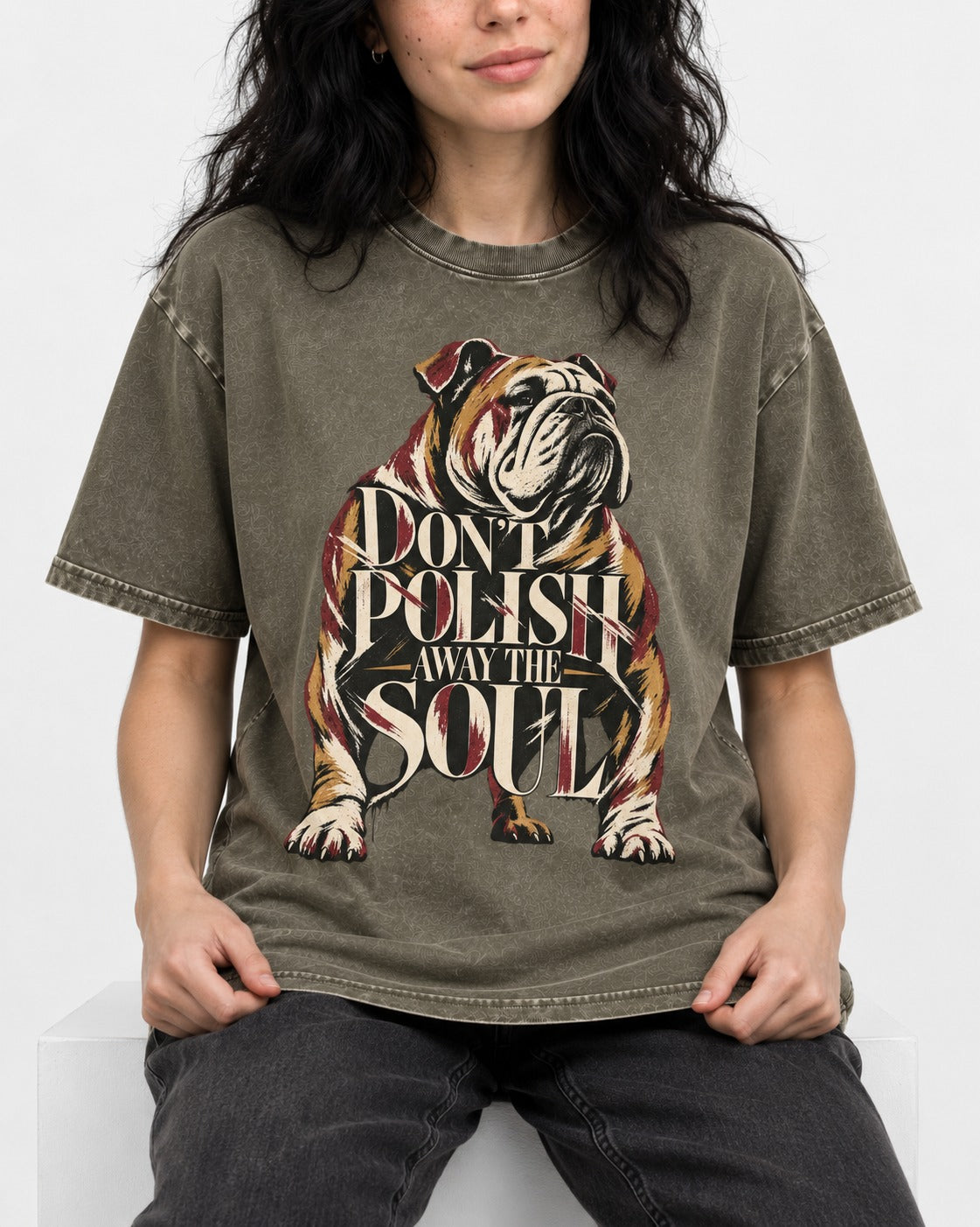 English Bulldog Don't Polish Away the Soul Typography Graphic Washed Tee in Army Green, worn by a seated model