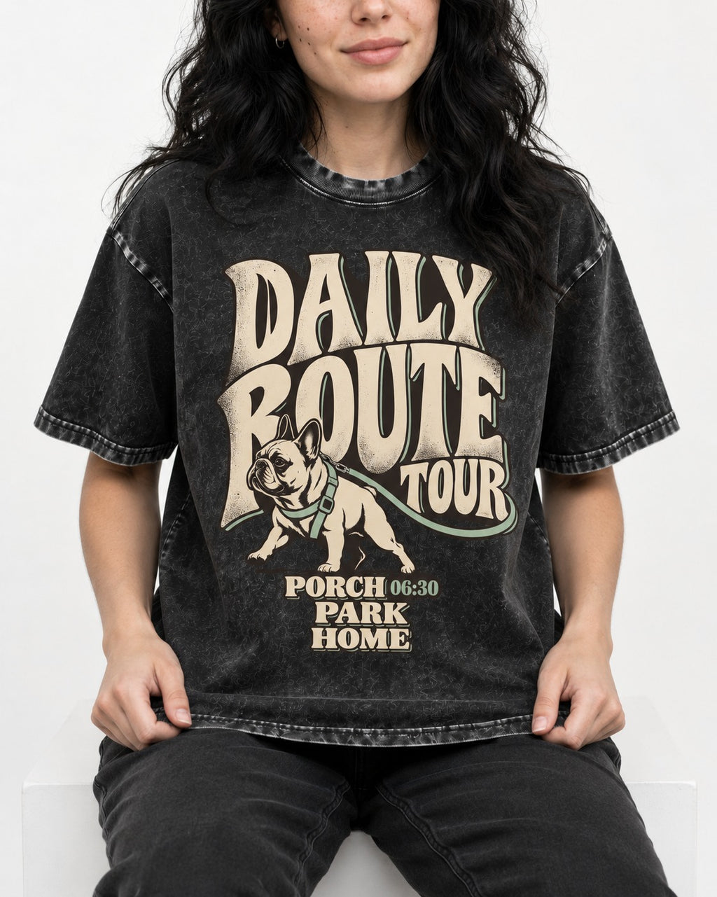 Frenchie Daily Route Tour Graphic Washed Tee in Black, worn by a seated model