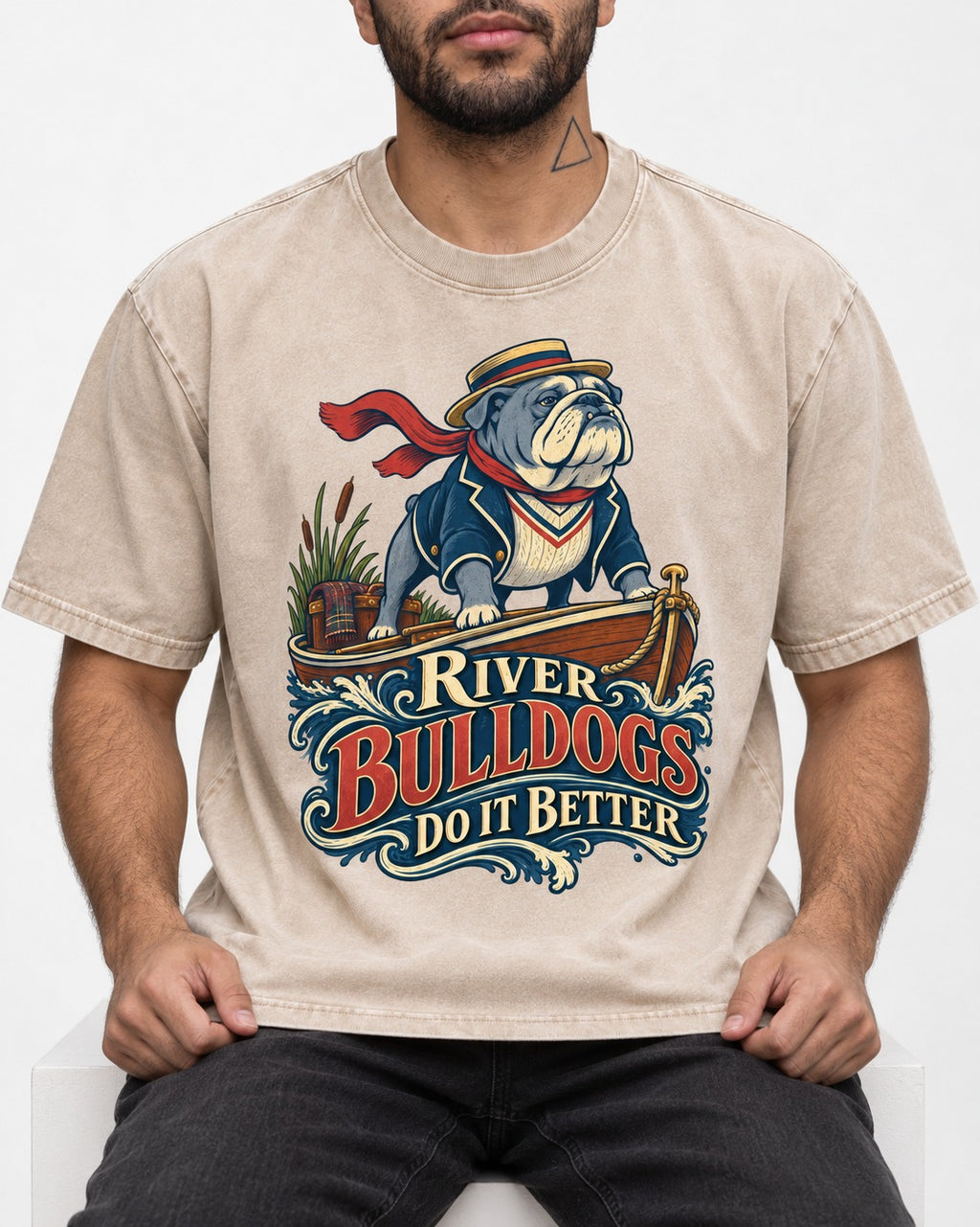 River English Bulldog Does It Better Washed Tee in Apricot, worn by a seated model