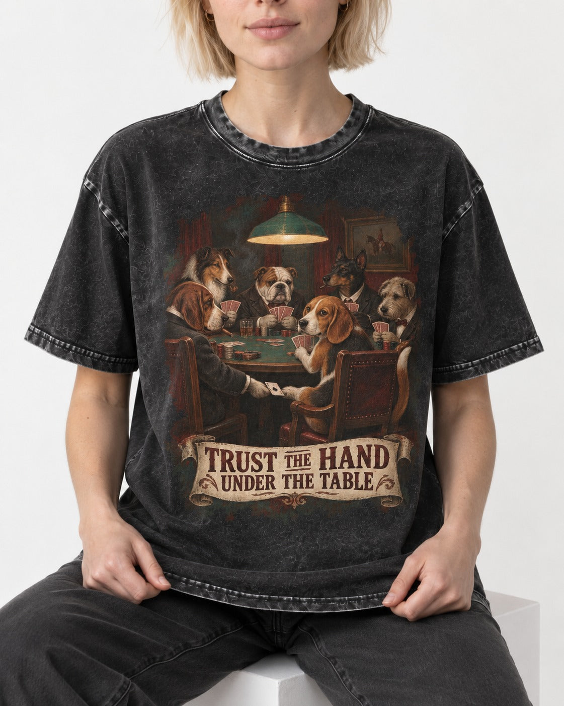 Trust The Hand Under The Table Beagle Poker Night Washed Tee in Black, worn by a seated model