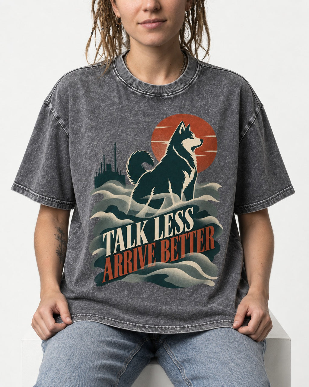 Husky Talk Less Arrive Better Harbor Wave Graphic Washed Tee in Gray, worn by a seated model