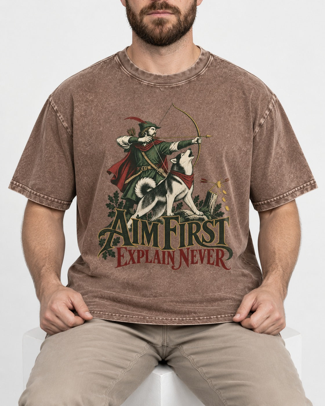 Husky Aim First Explain Never Washed Tee in Coffee, worn by a seated model