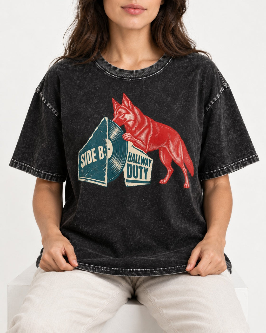Side B Hallway Duty Vinyl Record German Shepherd Dog Graphic Washed Tee in Black, worn by a seated model