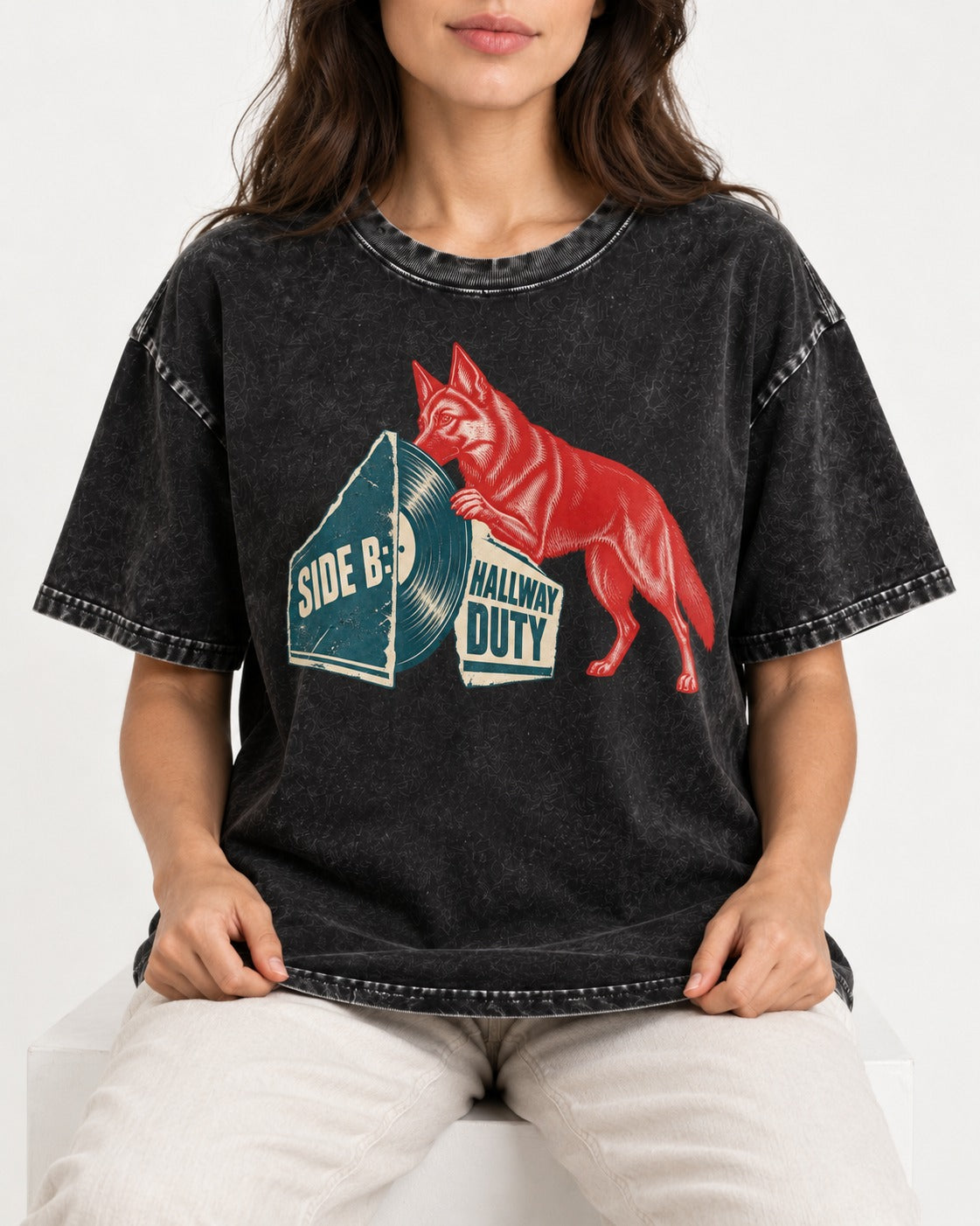 Side B Hallway Duty Vinyl Record German Shepherd Dog Graphic Washed Tee in Black, worn by a seated model