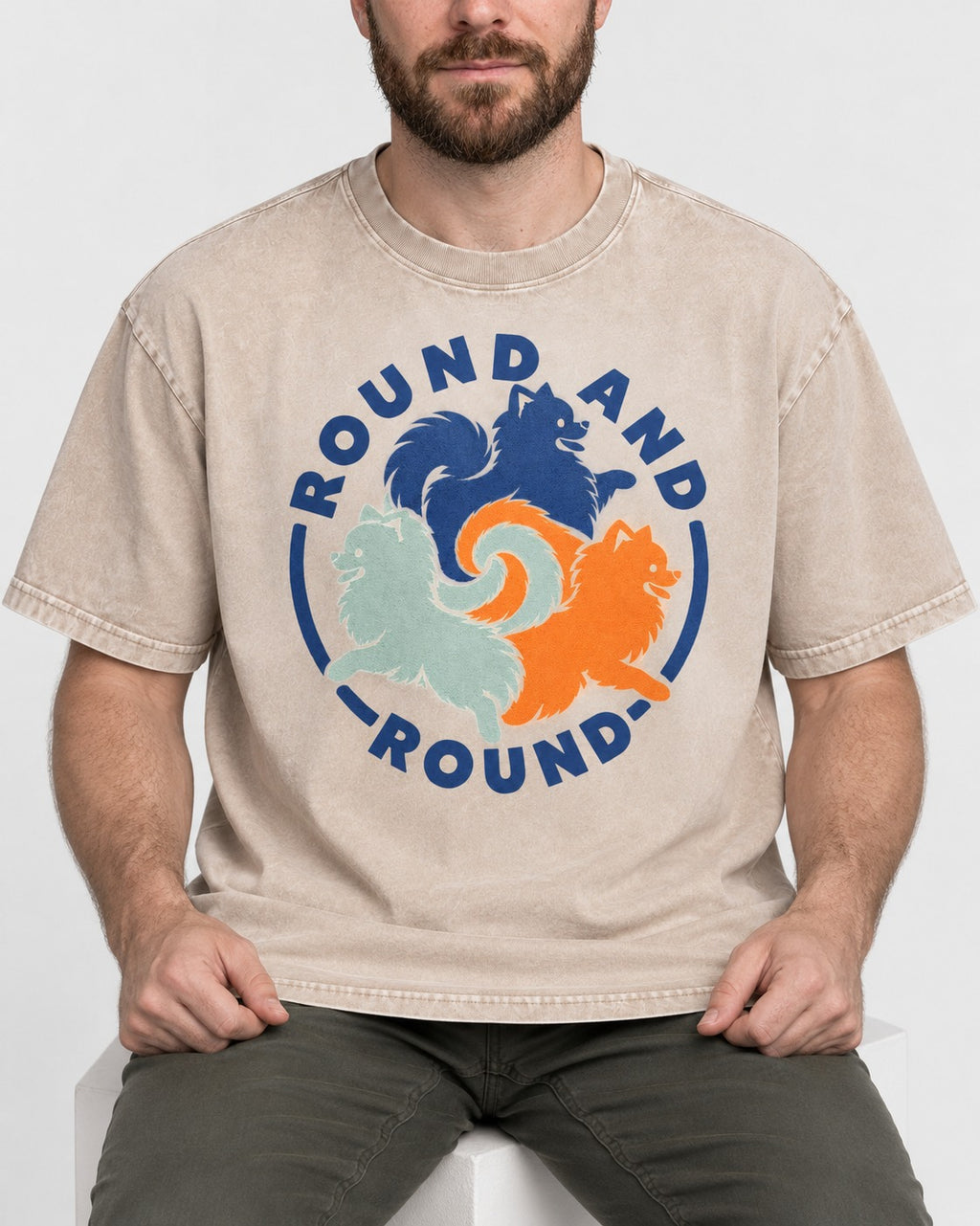 Pomeranian Round and Round Washed Tee in Apricot, worn by a seated model
