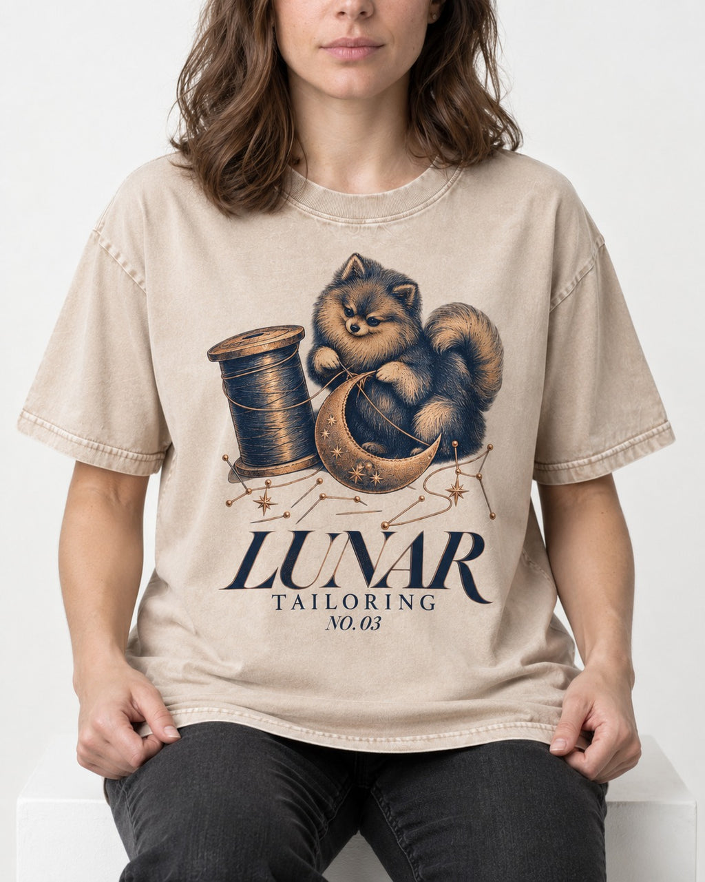Pomeranian's Lunar Tailoring Washed Tee in Apricot, worn by a seated model