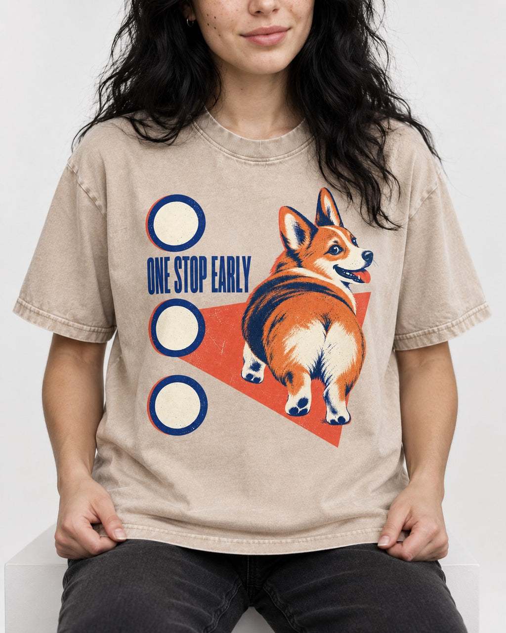 One Stop Early Corgi Washed Tee in Apricot, worn by a seated model