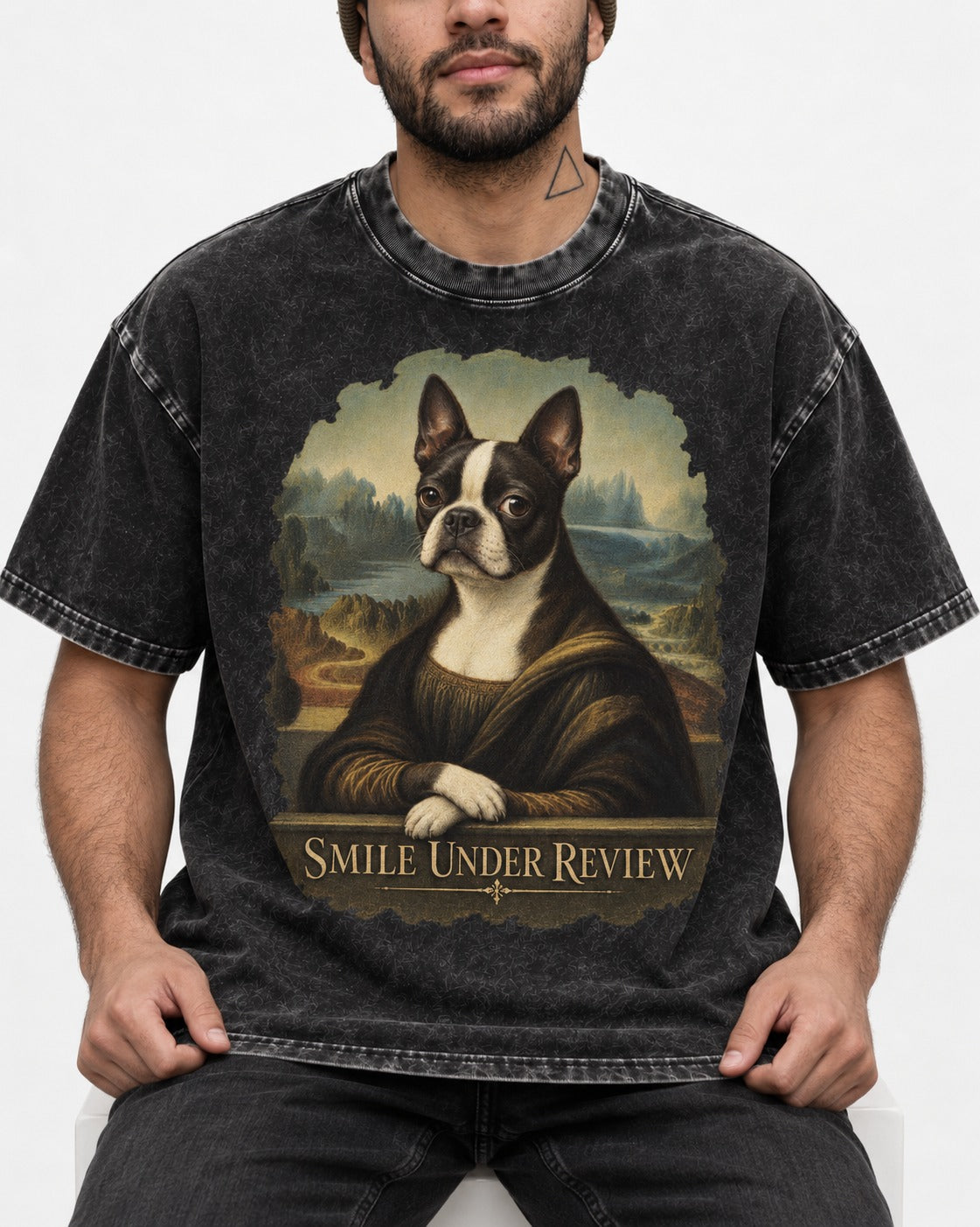 Smile Under Review Boston Terrier Mona Lisa Portrait Washed Tee in Black, worn by a seated model
