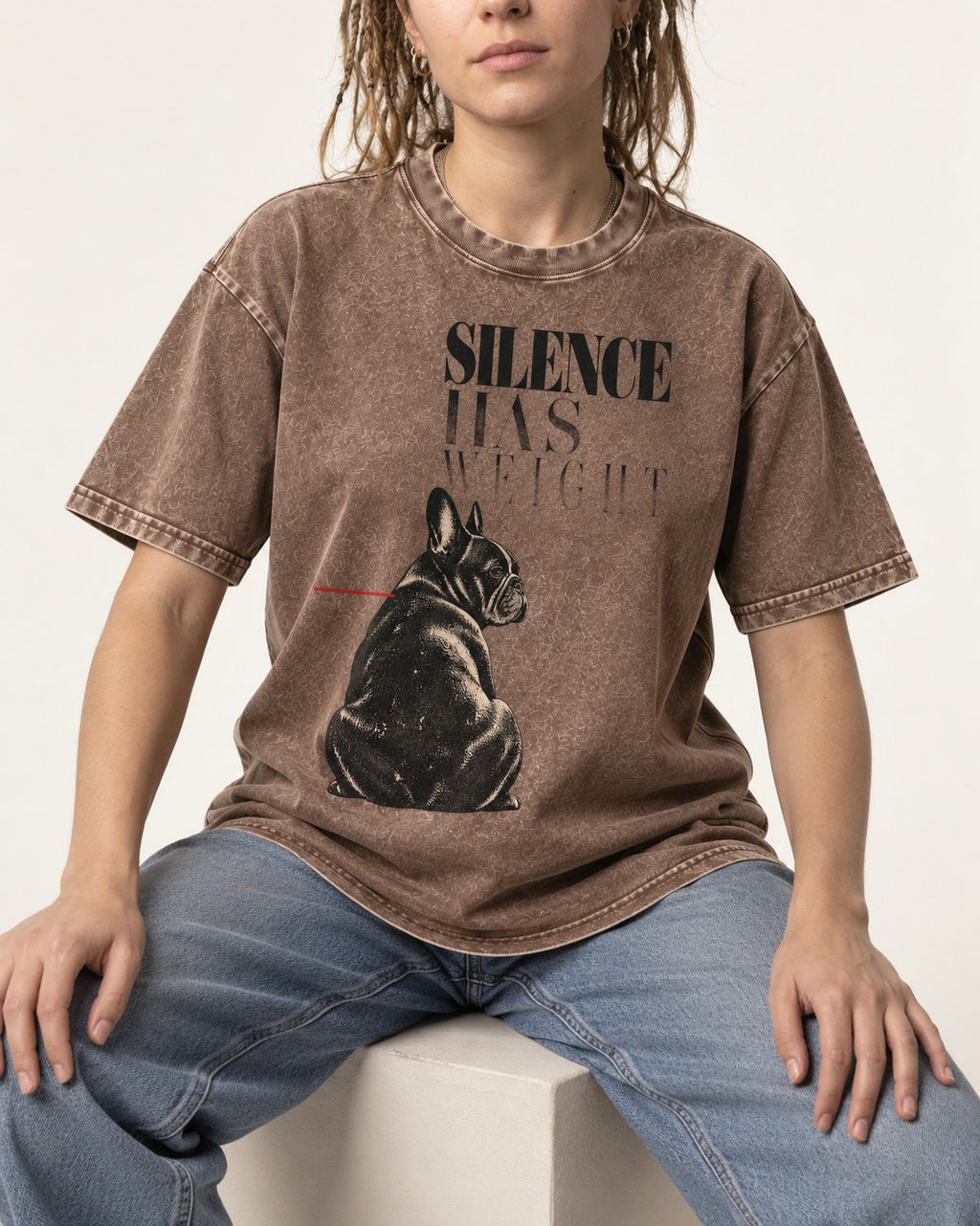 Silence Has Weight Frenchie Washed Tee in Coffee, worn by a seated model